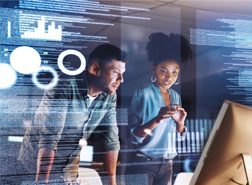 man and woman looking at code on a computer