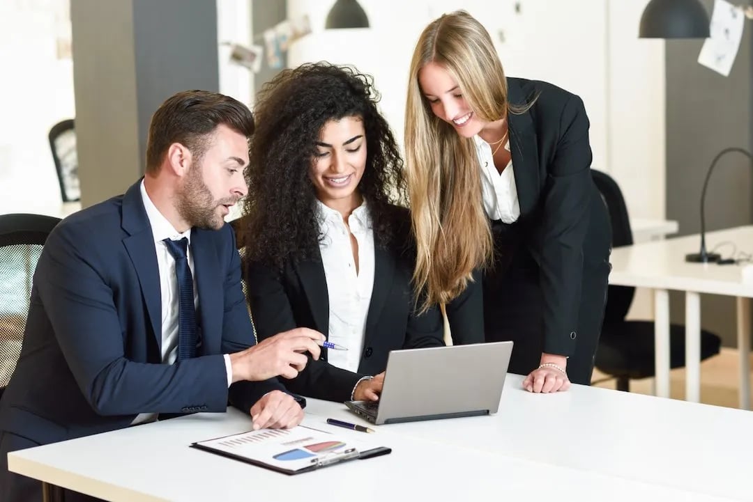 multi-ethnic-group-three-businesspeople-meeting-modern-office-two-women-caucasian-man-wearing-suit-looking-laptop-computer