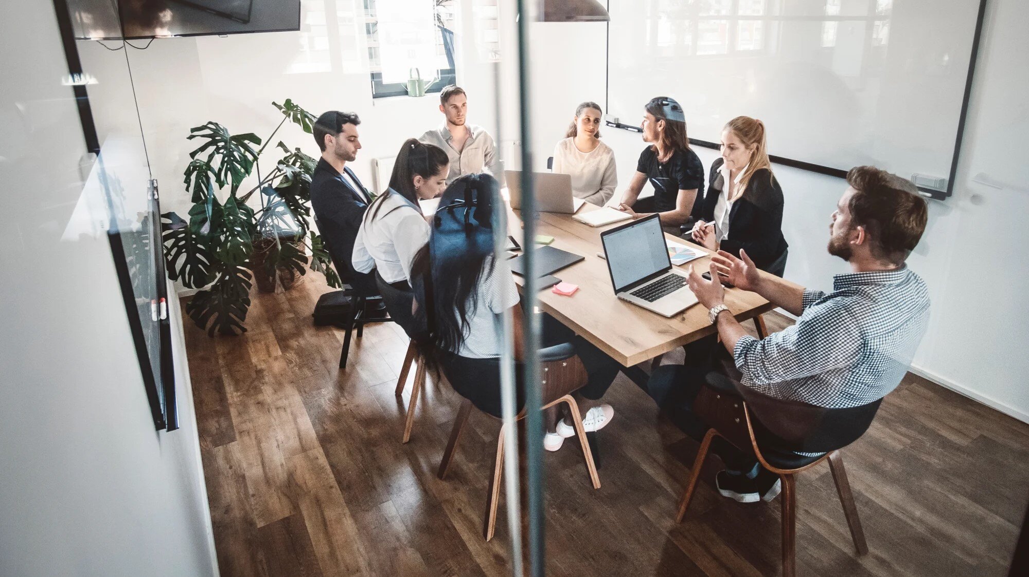 Office workers sitting round a table